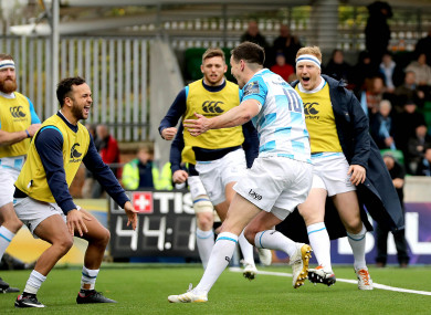 Sexton celebrates his try.