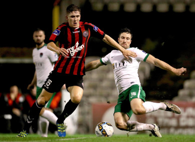 Oscar Brennan is tackled by Gearoid Morrissey.