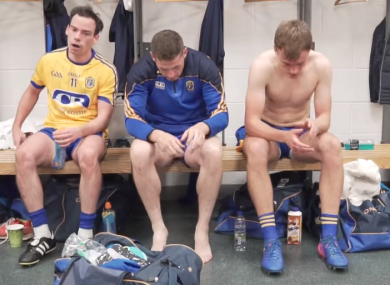 Roscommon players show their disappointment in the dressing room.