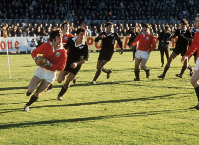 Barry John of the British Lions is pursued by Tane Norton of New Zealand in 1971.