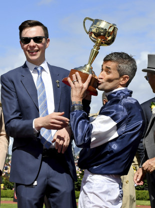O'Brien and jockey Corey Brown celebrate after the win.
