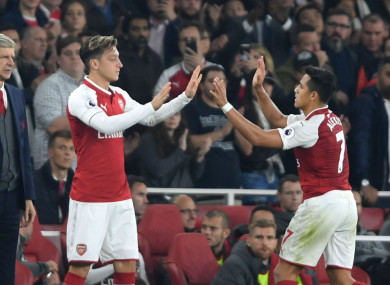 Arsenal manager Arsene Wenger with Mesut Ozil and Alexis Sanchez
