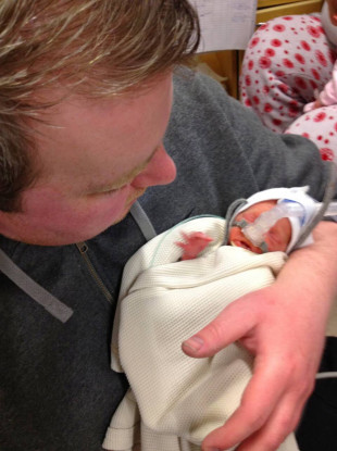 Peter holding Lucy just after her birth.