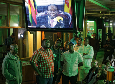 Disappointed Zimbabweans watch a televised address to the nation by President Robert Mugabe at a bar in downtown Harare.