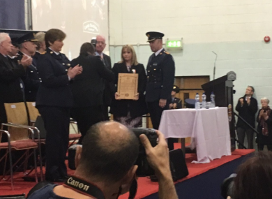 Minister Flanagan presents Nicola Golden with an award honouring her husband's bravery.