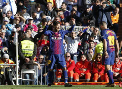 Barcelona's Lionel Messi, left, celebrates after scoring the second goal.