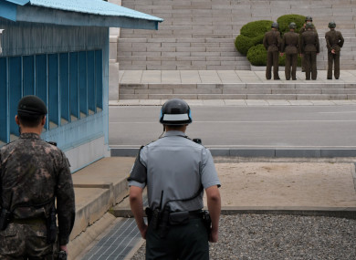 South Korean soldiers stand watching the North side at the joint security area (JSA) of Panmunjom in the demilitarised zone.