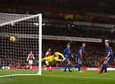 Arsenal's Hector Bellerin (obscured) scores his side's second goal of the game.