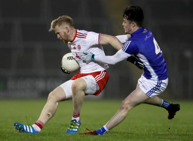 Cavan’s Darragh Kennedy with Frank Burns of Tyrone.
