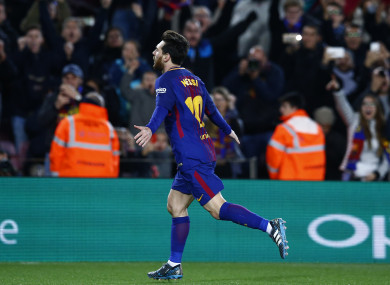 Messi wheels away in celebration.