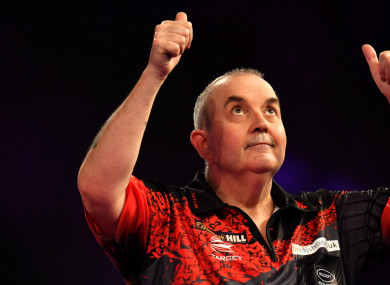 Phil Taylor celebrates reaching the World Darts Championship final.