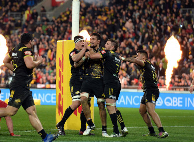Hurricanes celebrate Vaea Fifita's try against the Lions.
