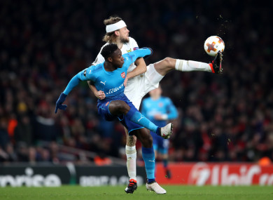 Ostersunds FK's Curtis Edwards and Arsenal's Danny Welbeck in action.