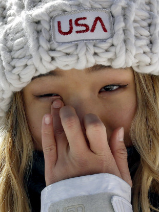 Chloe Kim, of the United States, wipes away a tear after winning gold in the women's halfpipe finals at Phoenix Snow Park.