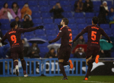 FC Barcelona's Gerard Pique, centre, celebrates after scoring.