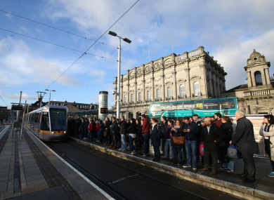Passengers at the Luas Heuston station stop.