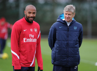 Henry pictured alongside Arsenal boss Arsene Wenger in 2011.