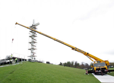 Workers build a stage at the Papal Cross in the Phoenix Park before a special mass for Pope John Paul II on the day of his funeral.