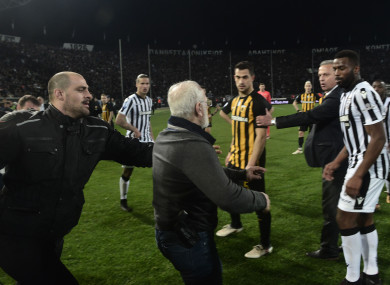 Paok president Ivan Savvidis takes to the pitch in Thessaloniki.
