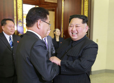 This picture - taken on 5 March 2018 and released from North Korea's official Korean Central News Agency (KCNA) on 6 March 2018 - shows North Korean leader Kim Jong-Un (right) shaking hands with South Korean chief delegator Chung Eui-yong