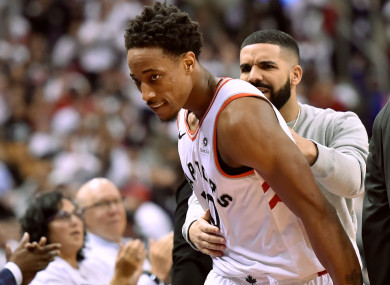 Drake gives DeMar DeRozan some tips from court side last night.