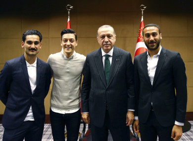 Turkey's President Recep Tayyip Erdogan, right, poses for a photo with Turkish Premier League soccer players Ilkay Gundogan, left, Mesut Ozil, second left, and Cenk Tosun in London.