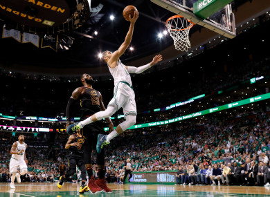 Jayson Tatum attempts a layup in front of LeBron James during the third quarter of game five.