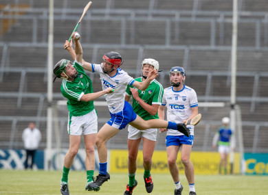 Limerick's Barry O'Connor and Diarmuid Hegarty with Ryan Tierney and James Power of Waterford.