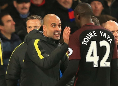 Manchester City manager Pep Guardiola (left) and Yaya Toure
