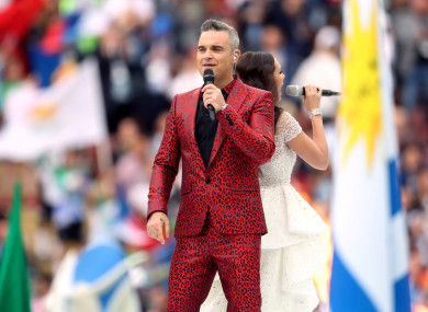 Robbie Williams and Aida Garifullina perform at the opening ceremony.