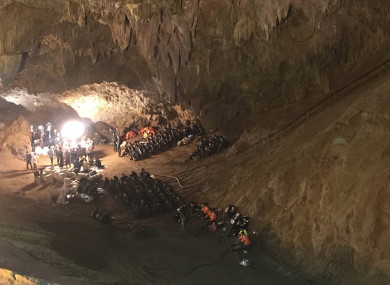 Emergency rescue teams gather in the staging area as they continue the search for the young soccer team and their coach