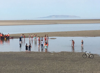 Emergency services attend the scene of the incident on Burrow Beach
