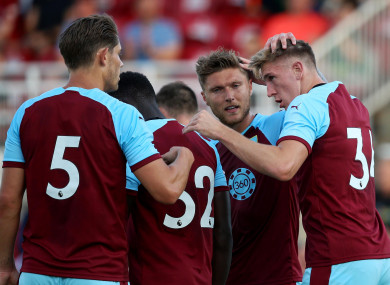 Burley's Jimmy Dunne celebrates scoring a goal with team-mates.