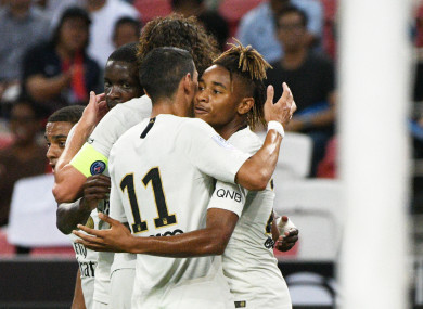 The PSG players celebrate scoring.