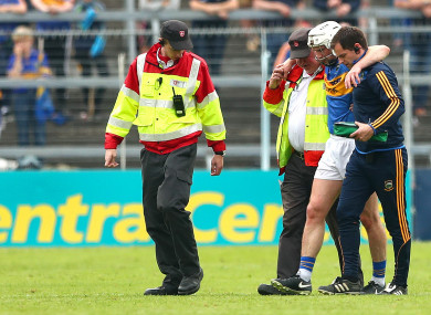Brendan Maher is helped off my Tipperary medics after their loss to Clare.