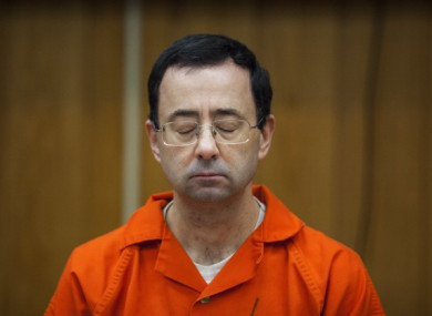 Larry Nassar listens during his sentencing in February.