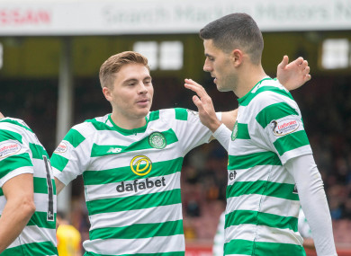 Celtic's Tom Rogic (right) celebrates scoring his side's third goal of the game.