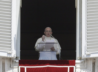 Pope Francis delivers his message during the Angelus noon prayer in St Peter's Square at the Vatican.