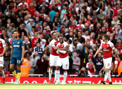 Alexandre Lacazette celebrates scoring Arsenal's third goal.