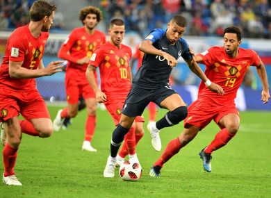 France striker Kylian Mbappe surrounded by Belgian players during the World Cup semi-final.