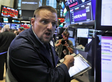 Trader Michael Milano on the floor of the New York Stock Exchange.
