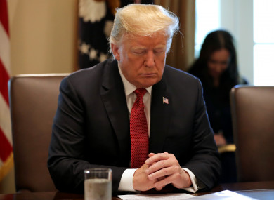 Donald Trump during a prayer before a meeting of his cabinet in the Cabinet Room at the White House.