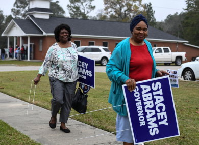 Supporters of Georgia gubernatorial candidate Stacey Abrams pictured yesterday. Abrams, who could became the US's first African American woman governor, is in a close tie with opponent Brian Kemp in one of the most-watched midterm races.