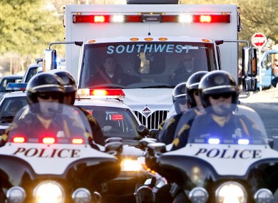 An ambulance carries Gabrielle Giffords to an airport in Tuscon, where she was airlifted to Houston.