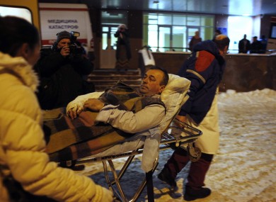 A blast victim is brought by rescuers to a hospital from Domodedovo airport.