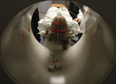 A patient is examined during a scan.