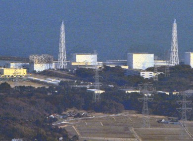 The nuclear plant at Fukushima, pictured yesterday, with the damaged containment building at reactor 1 on the left. The nuclear cores at all three reactors are now thought to be melting.