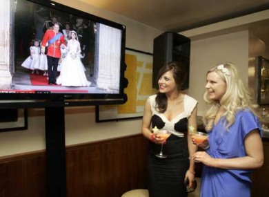 Annmarie Blennerhassett, right, from Kerry and Ellen Wallace from Cork watch the royal wedding at the Fitzwilliam Hotel today.