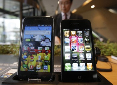 Samsung's Galaxy S (left) displayed alongside Apple's iPhone 4.