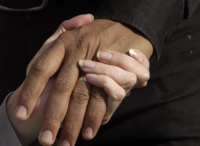 Multiple sclerosis sufferer Debbie Purdy holds her husband's hand. Purdy is noted for her campaign to change the laws of assisted death in the UK.